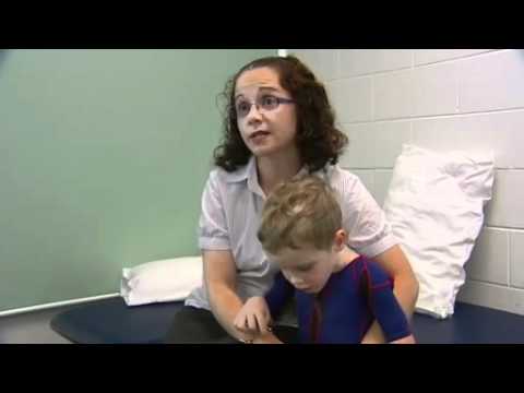 Boy helps trial orthotic body suit