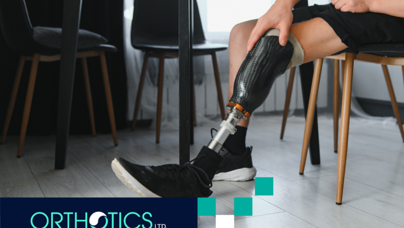 A man wearing prosthetics sitting