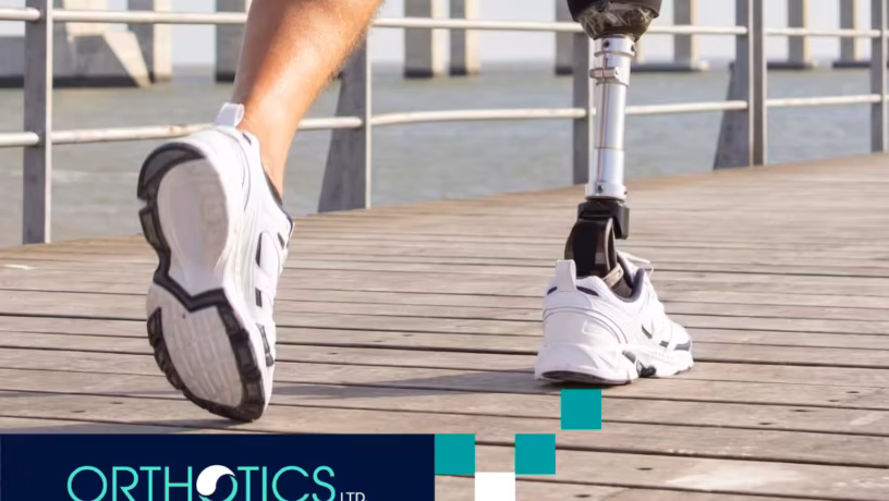 An amputee with prosthetics is running outdoors