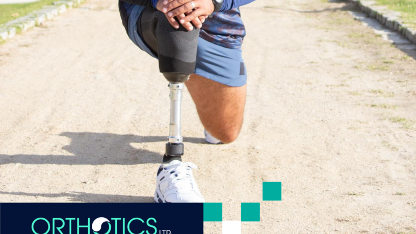 An amputee wearing a lower-limb prosthesis stretching his legs