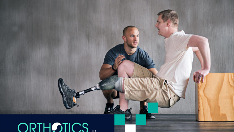 An amputee wearing prosthetics doing stretches with his therapist during occupational therapy