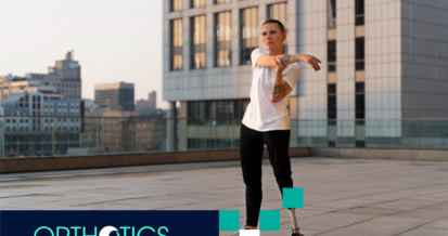 An amputee wearing a prosthetic stretching outdoors