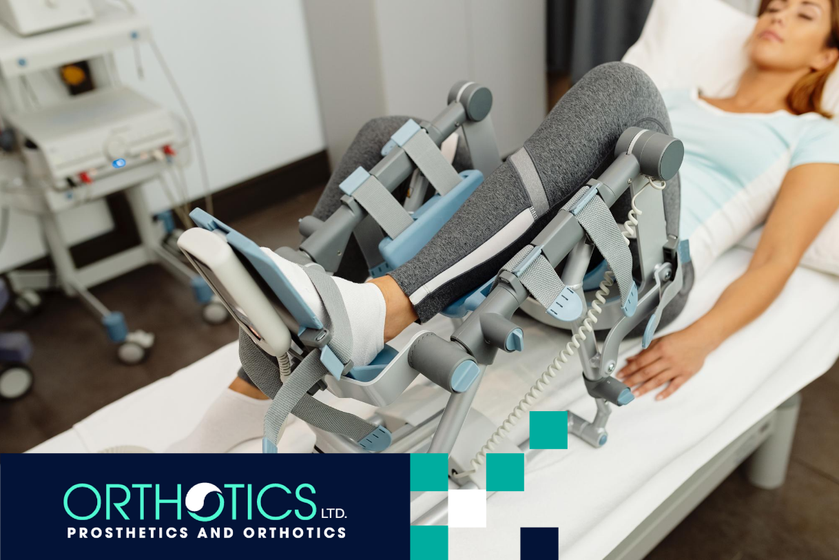 A woman laying on a bed for orthotics fitting