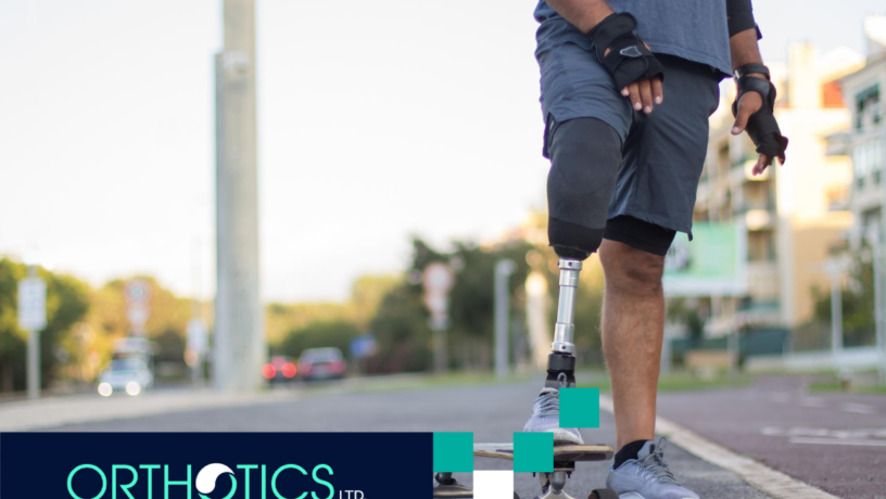 An amputee wearing a prosthetic leg skating outdoors