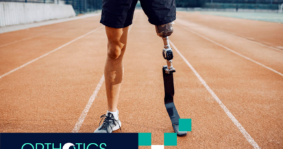 An athletic amputee wearing prosthetic standing in a track field