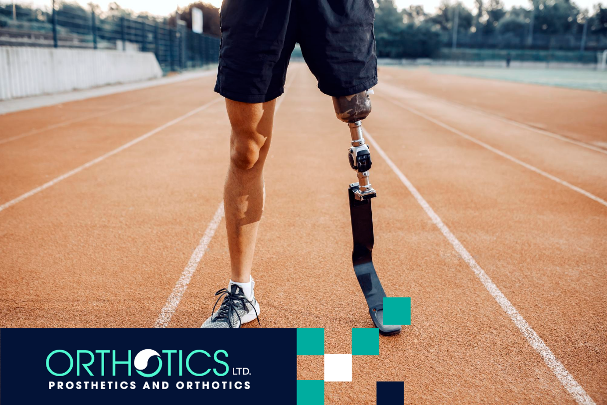 An athletic amputee wearing prosthetic standing in a track field