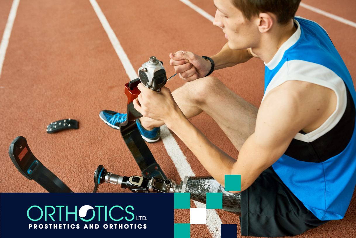An amputee athlete fixing his prosthetic
