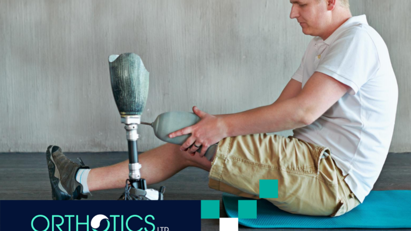 An amputee wearing prosthetics doing home exercise