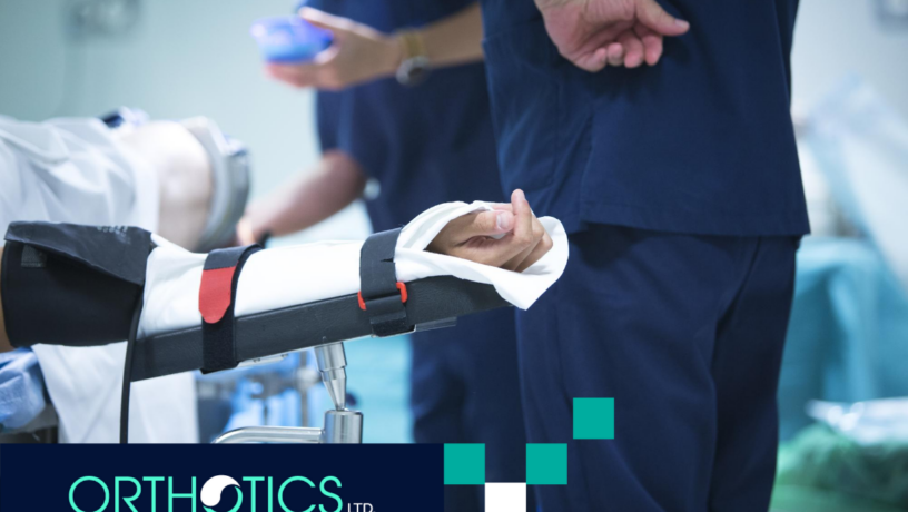 A patient lying on a hospital bed with doctors surrounding him