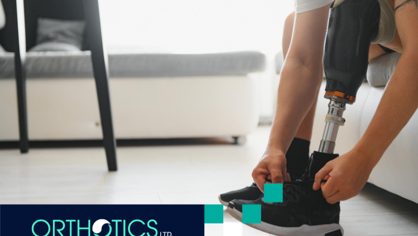 An amputee wearing prosthetic fixing his shoelace