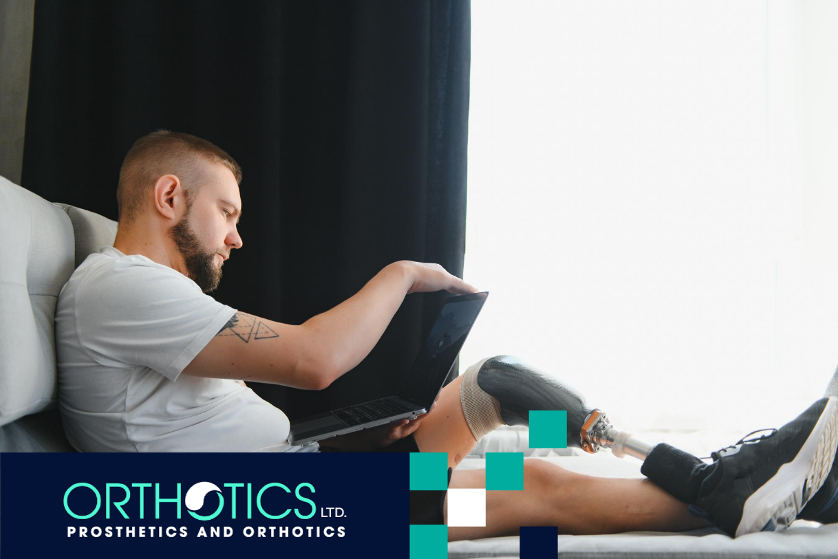 A man wearing prosthetics sitting on a couch
