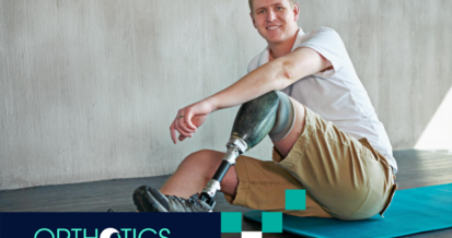 An amputee wearing prosthetics sitting on a mat