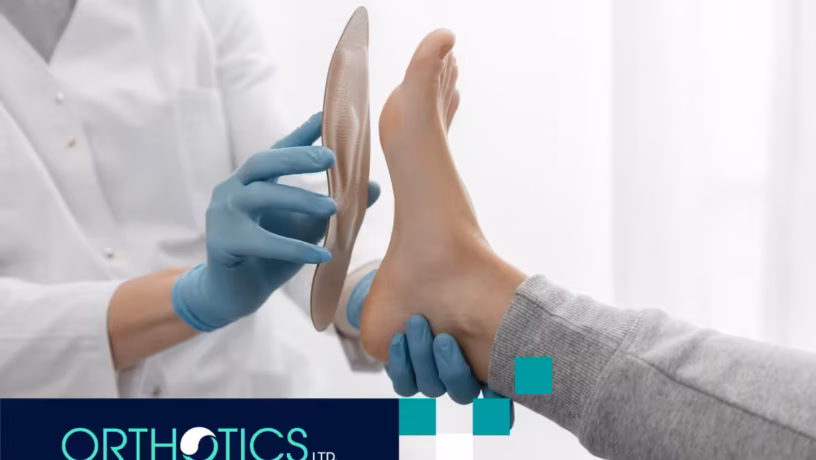 A professional is helping a patient fit an orthotic insole