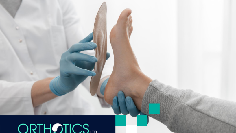 A professional is helping a patient fit an orthotic insole