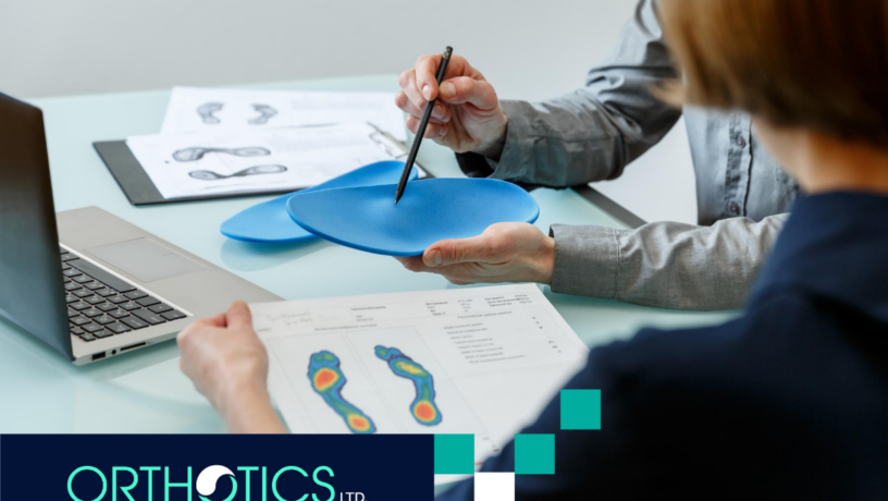 A prosthetist showing an orthotic to a patient