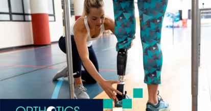 A therapist helping an amputee wearing prosthetics