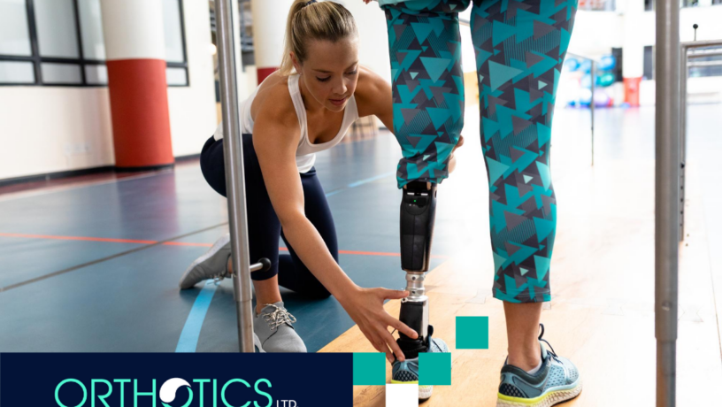 A therapist helping an amputee wearing prosthetics