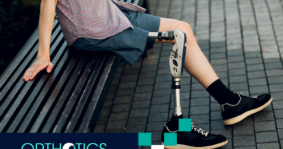 An amputee wearing prosthetics sitting on a bench outdoors