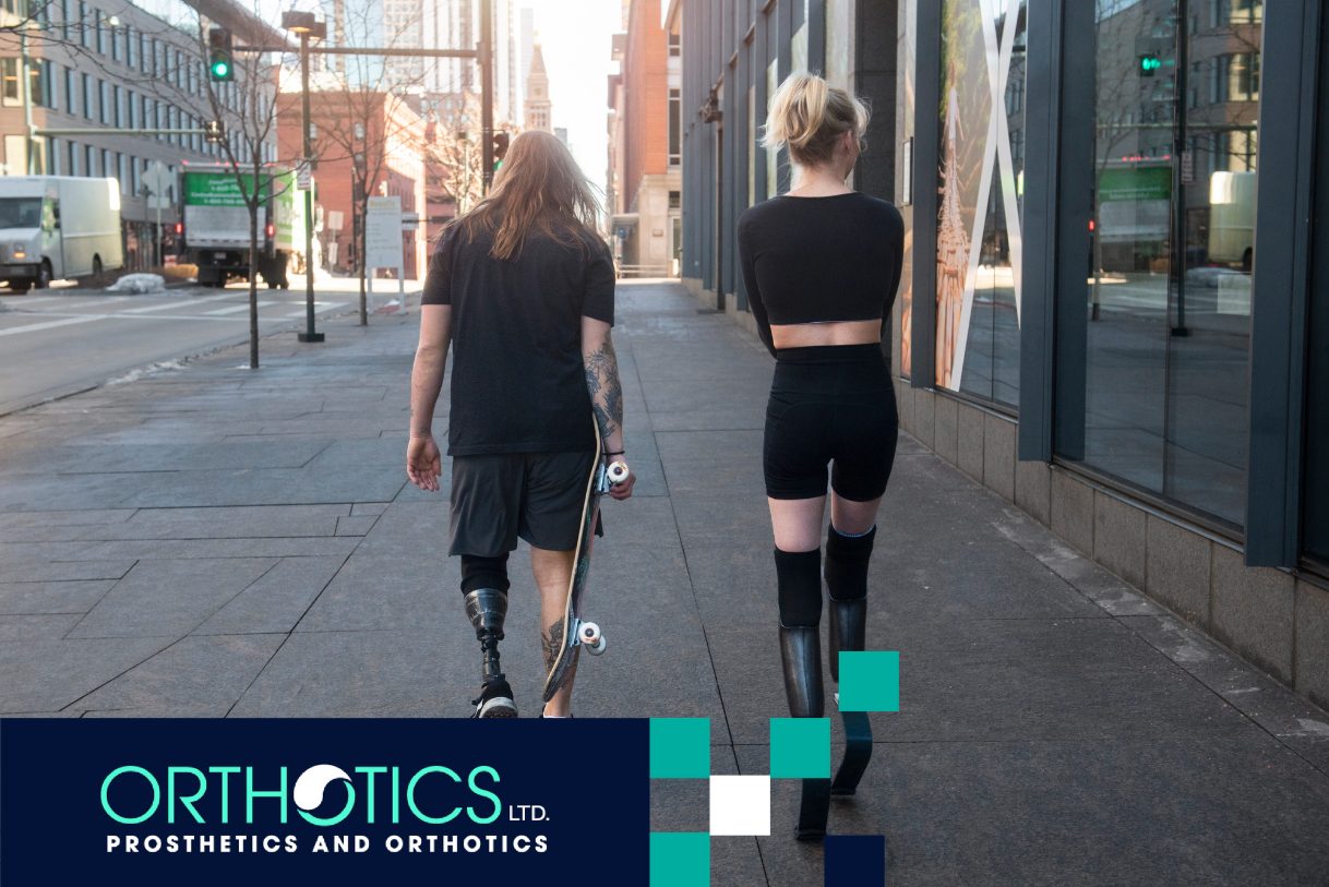 Two amputees wearing prosthetics walking together outdoors