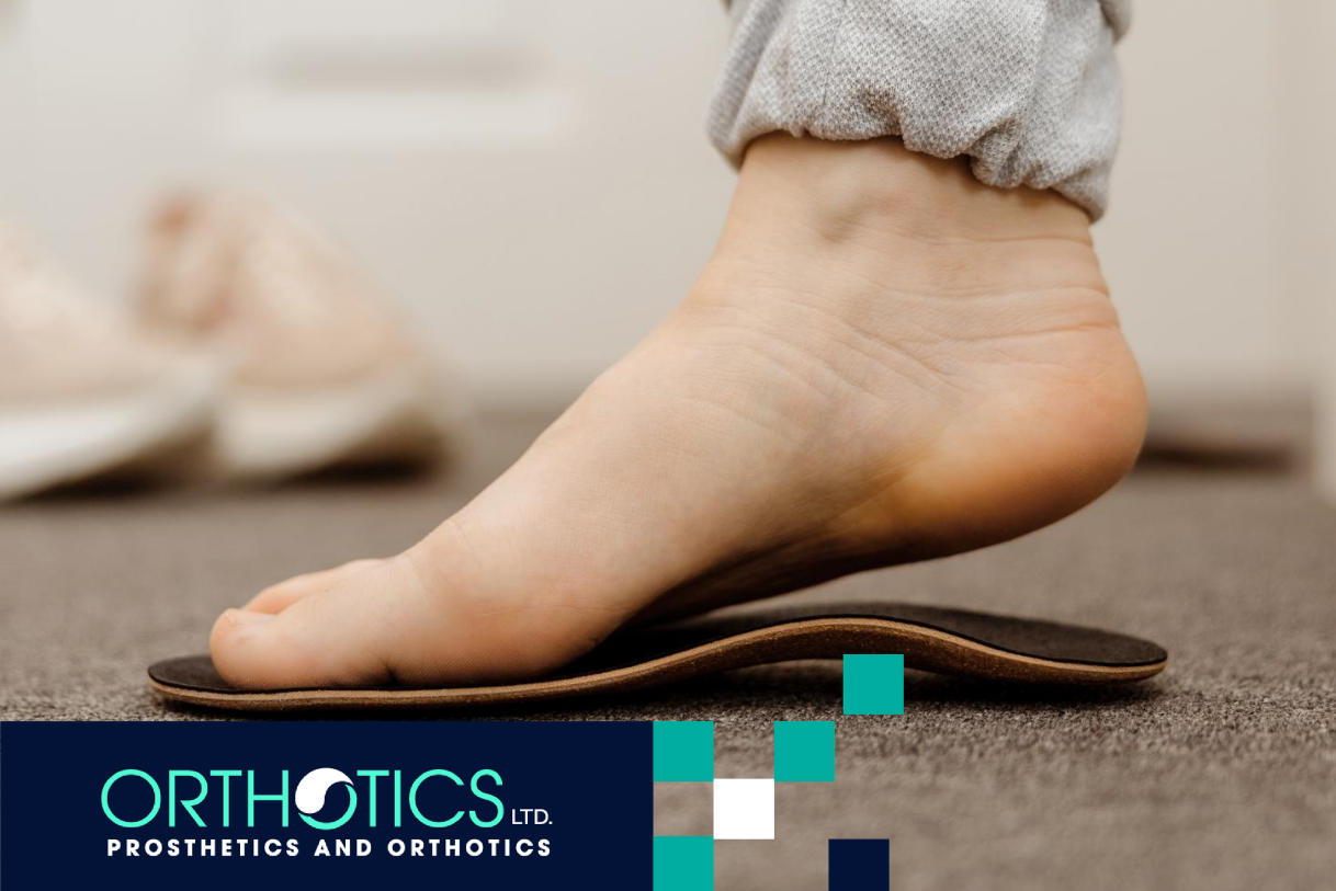 A foot fitting an orthotic insole