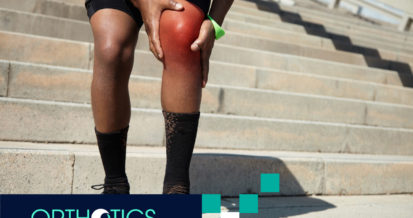 A man holding his knee in pain