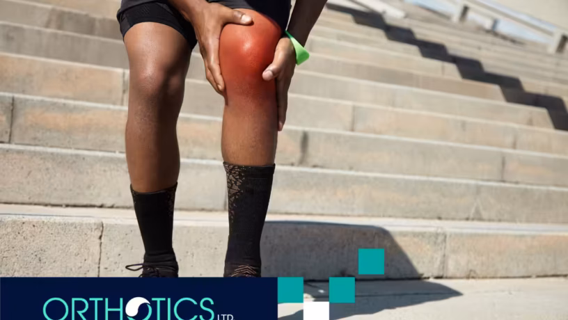 A man holding his knee in pain