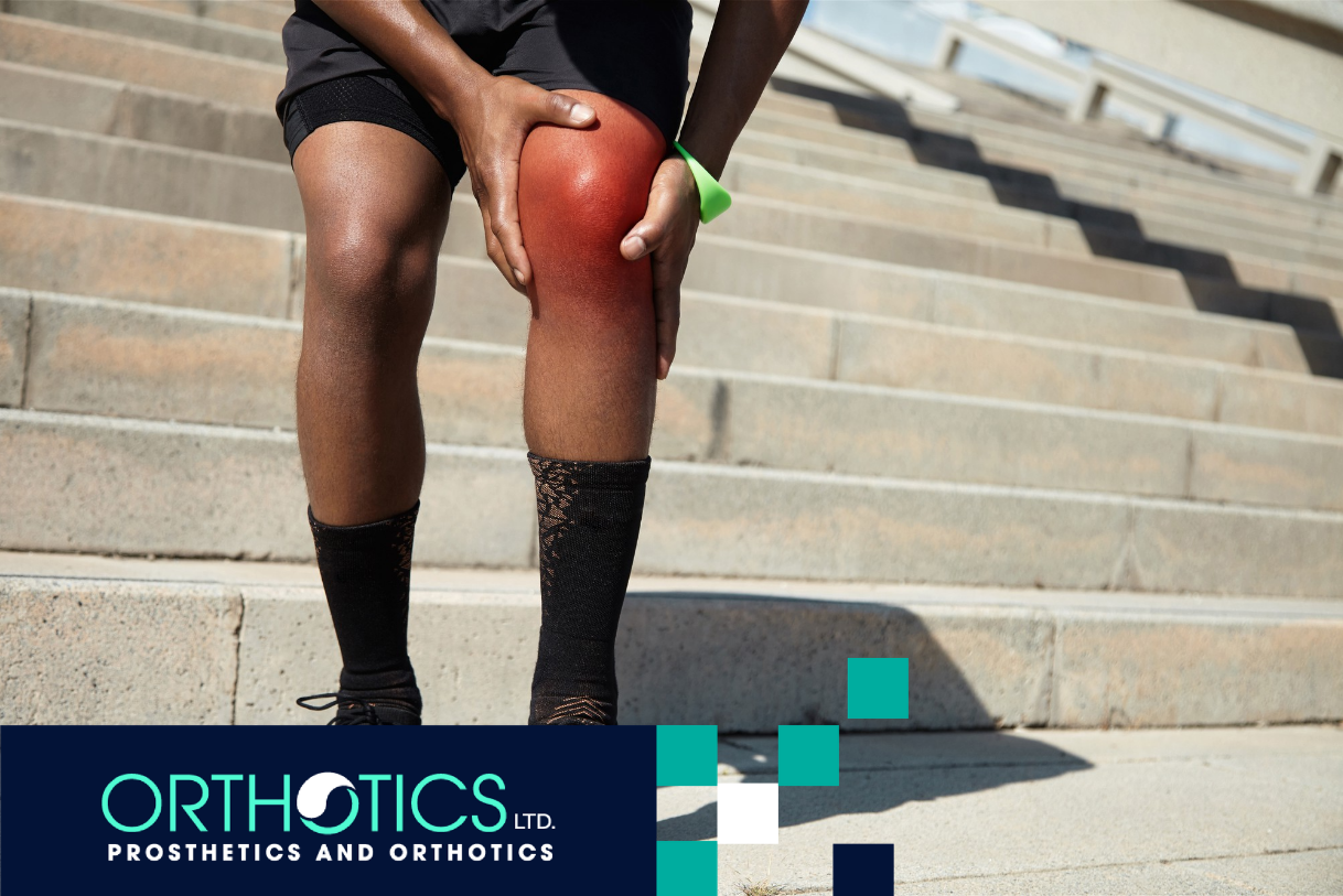 A man holding his knee in pain