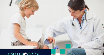 A child's leg being checked by a doctor