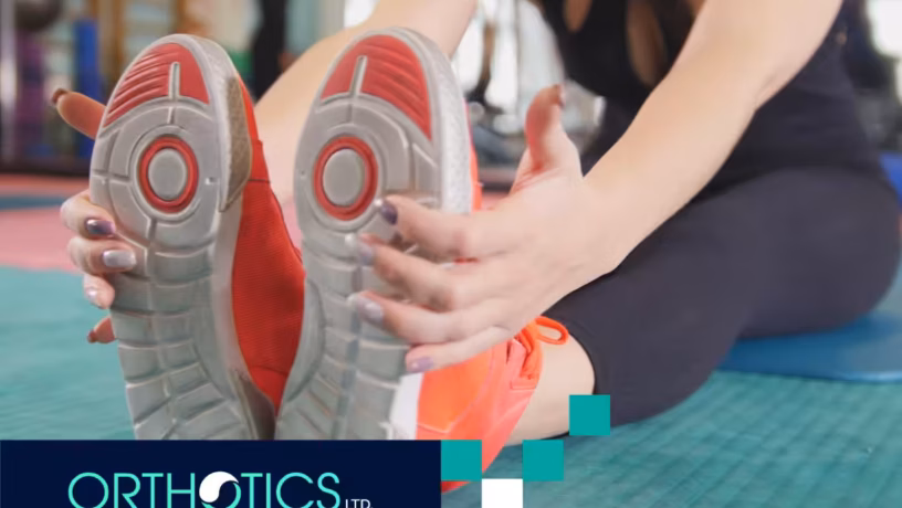 A person breaking in her shoes with orthotic insoles
