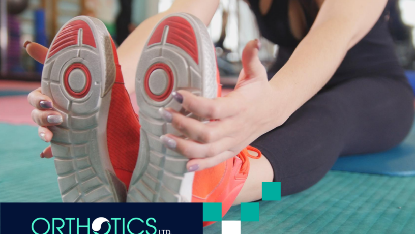 A person breaking in her shoes with orthotic insoles