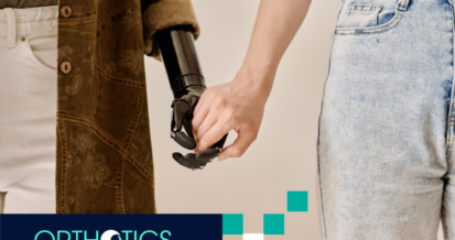 A person holding the hand of another person wearing prosthetic covers