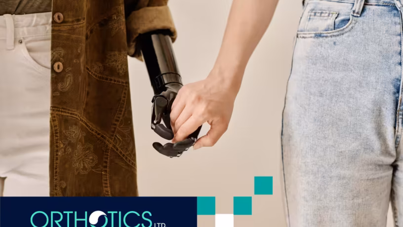 A person holding the hand of another person wearing prosthetic covers