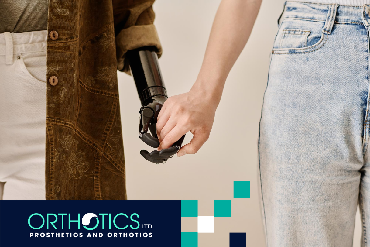 A person holding the hand of another person wearing prosthetic covers