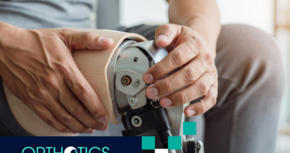 A man wearing prosthetic sitting on a couch
