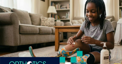A kid wearing prosthetics doing skin care