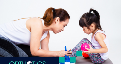 A child getting her orthotic checked by her mother