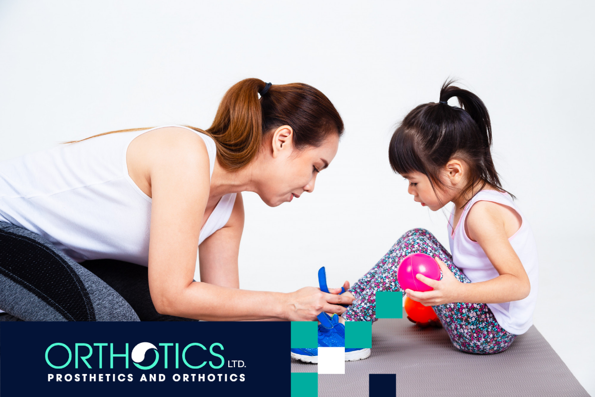 A child getting her orthotic checked by her mother