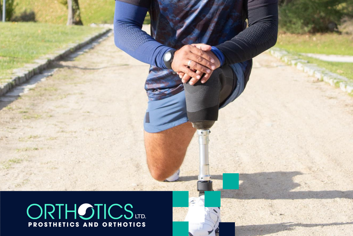 An amputee wearing a prosthetic stretching outdoors