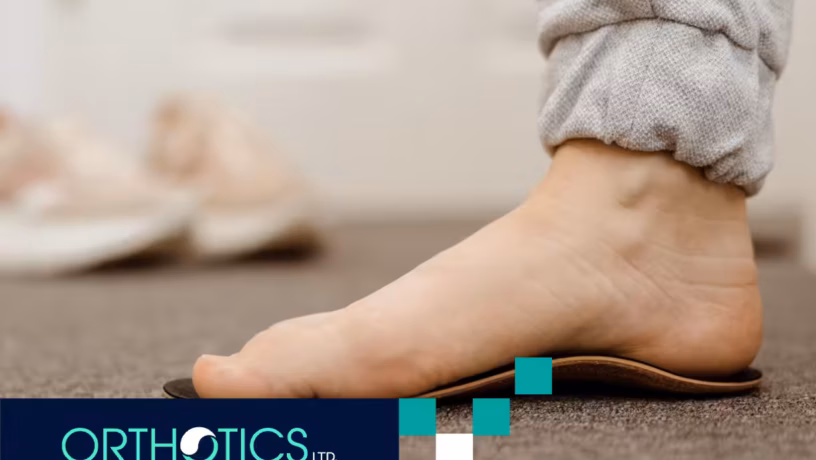 A flat foot stepping on a custom orthotic shoe insole