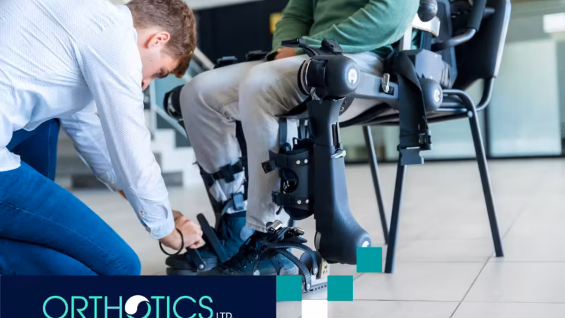 A prosthetist fitting a prosthetic to an amputee