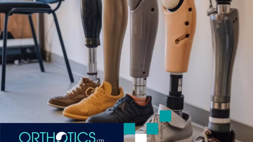 Several limb prosthetics lined up against the wall