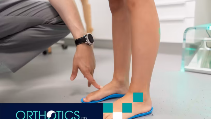A person fitting an orthotic insole